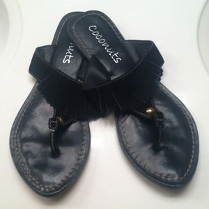 Black leather flip flops