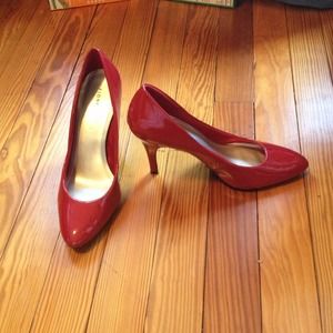 Red patent pumps