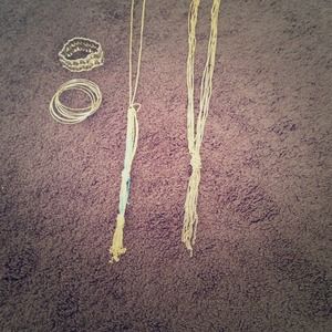 Bangles, a bracelet, and two necklaces. Gold