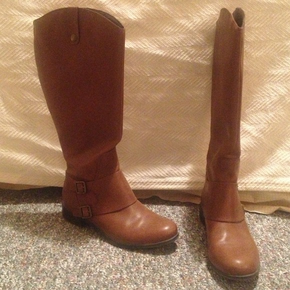 Brown leather riding boots.