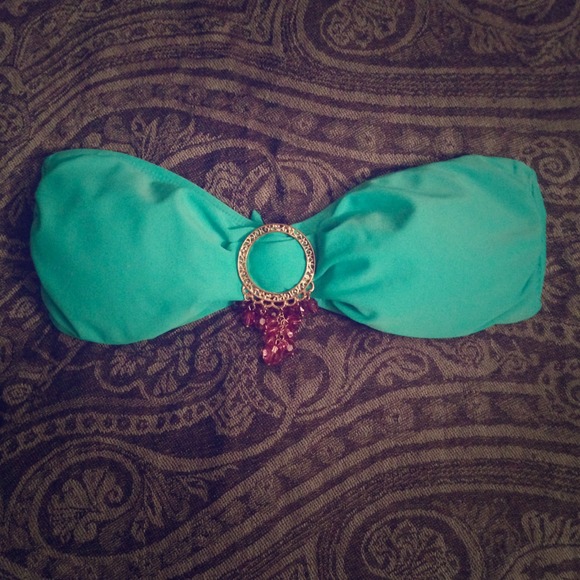 Turquoise bikini top with purple embellishments