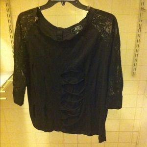 Black blouse with fashionable tears