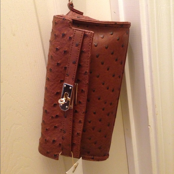 Reserved. Faux ostrich clutch wth shoulder strap.