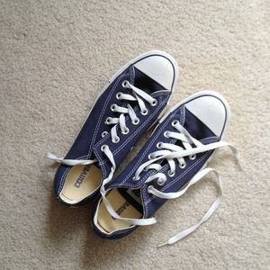 Chuck Taylor Navy Converse shoes.