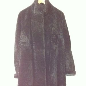 Black, soft leather Spanish merino shearling coat.