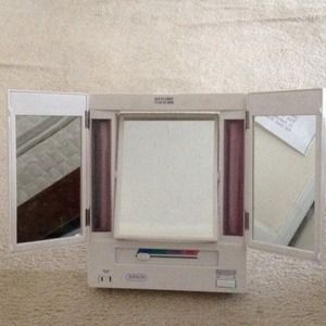 Vanity mirror w/additional attached plug