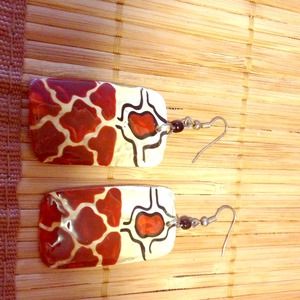 Handmade giraffe print earrings.
