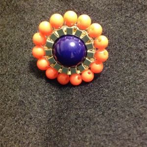 Coral, blue, and gold accent ring.