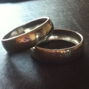 Two silver bracelets one with texture.