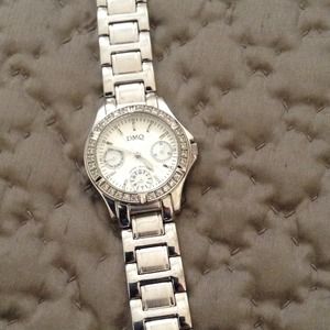 DMQ silver watch with simulated diamond bezel