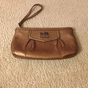 Light brown coach clutch. Used a few times.