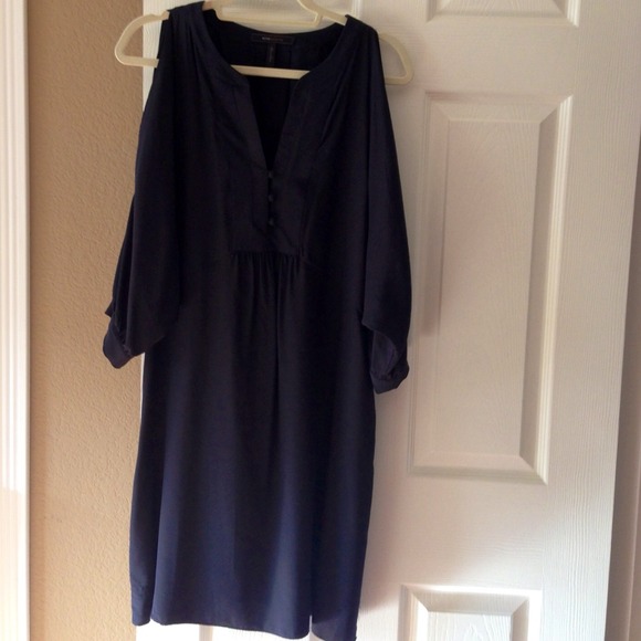 Open shoulder, knee length LBD.