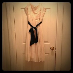 Cream color, knew length dress ;)