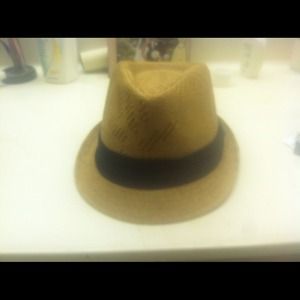 Tan fedora with black ribbon