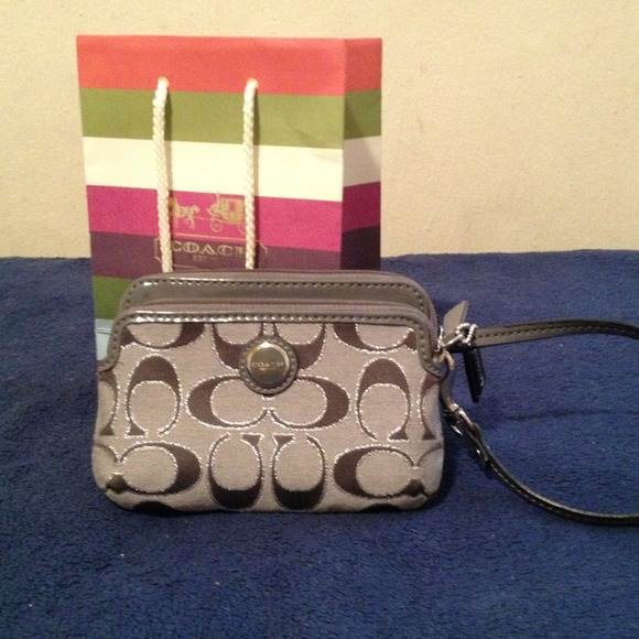 Coach small cell phone wristlet; silver/gray.