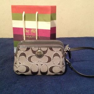 Coach small cell phone wristlet; silver/gray.