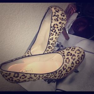 Oh Deer Leopard print heals with red bottoms.