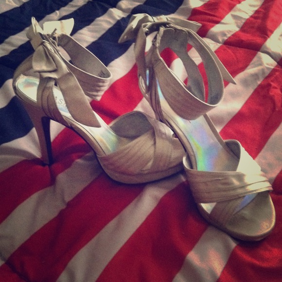 Silver heels with bows on back