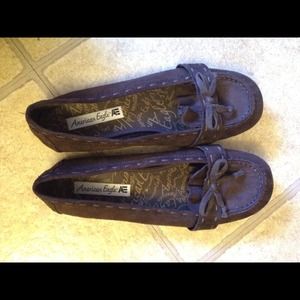 Brown moccasin inspired flats.