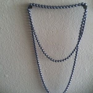 Faux 60 inch bead necklace in a pretty silver