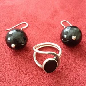 Set of matching black and silver ring and earrings