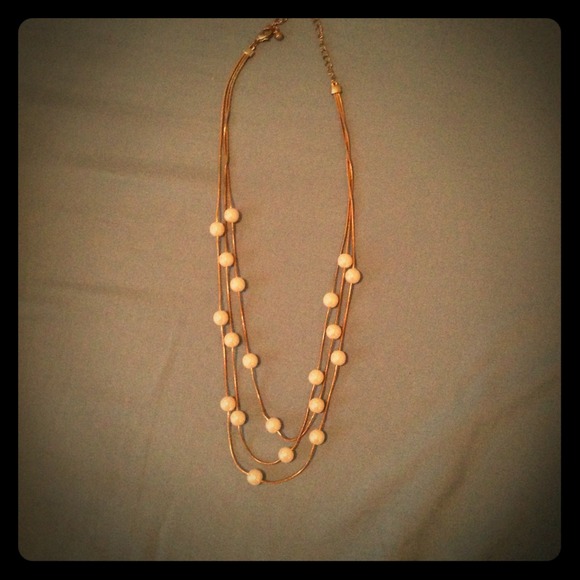 Three strand gold pearl necklace