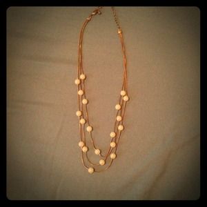 Three strand gold pearl necklace