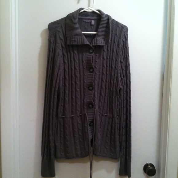 Grey sweater and black multi colored shirt