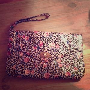 Over sized clutch with wrist strap.