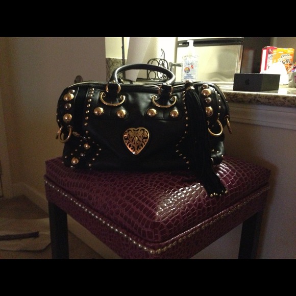 100% leather studded hand bag.