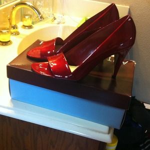 Red patent pumps