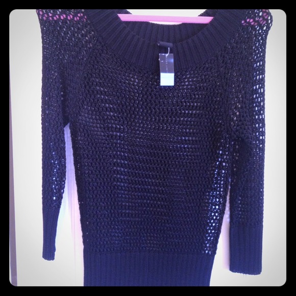 Never worn. Black crochet 3-quarter length shirt.
