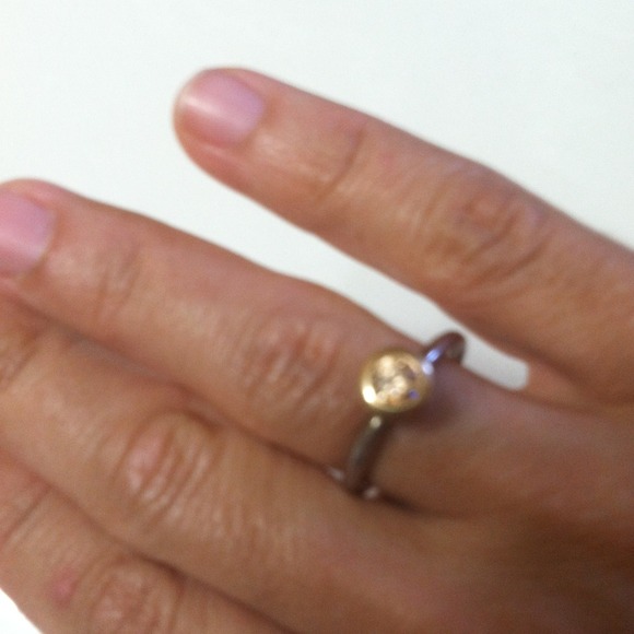 Beutiful Padora ring with a  yellow rock reserved