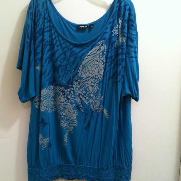 Blue top with gray tribal butterfly.