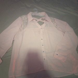 A pink long sleeve button up