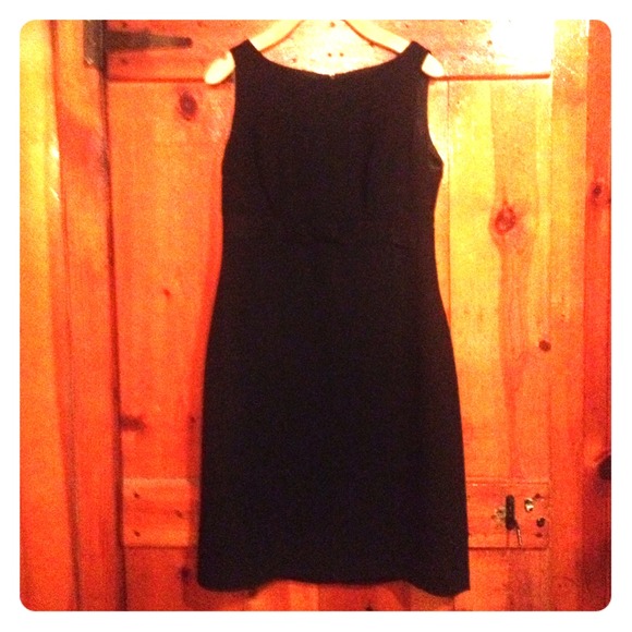 Classic black dress with ribbon around the torso