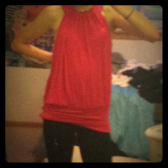 Pink, loose, long to tight fit shirt.
