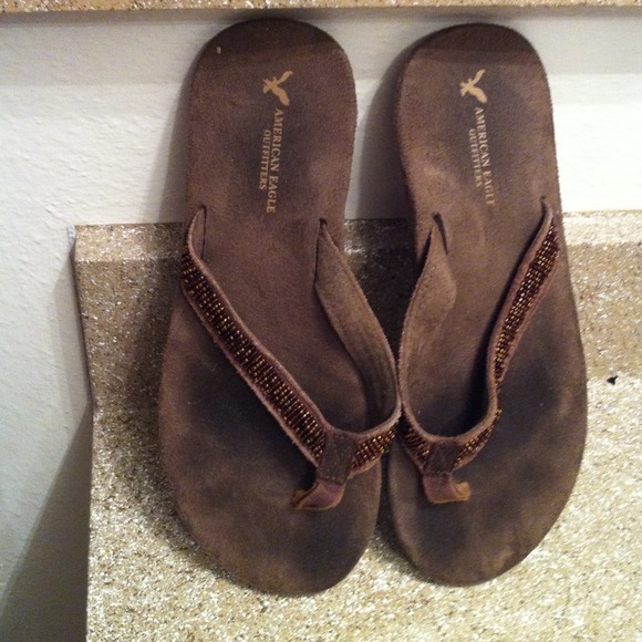 Dark brown suede flip flops with beaded thong