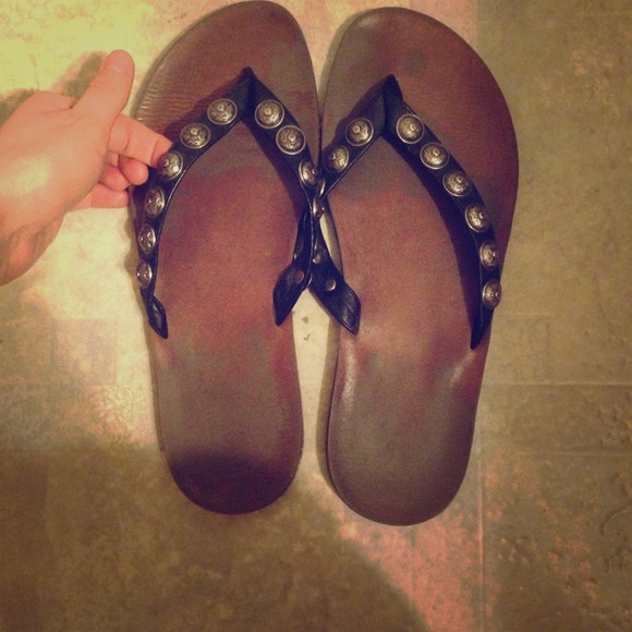 Black studded flip flops