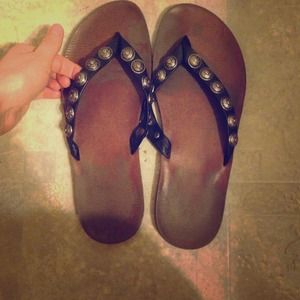 Black studded flip flops