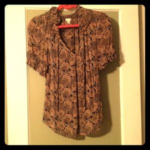 This is an Odille blouse from Anthropologie.