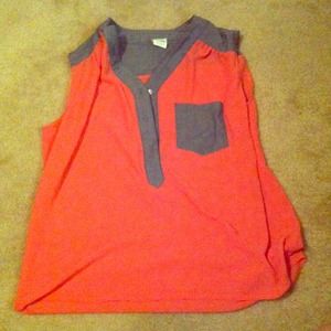 Coral button down blouse with grey trimming.