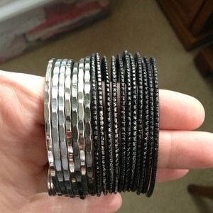 Large set of black and silver bangles