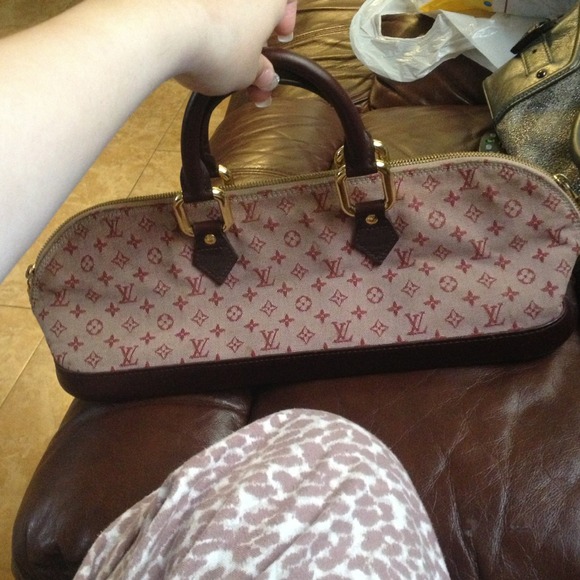 Pink w/ leather handles Louis Vuitton purse..