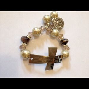 Cross OurFather prayer engraved in Spanish