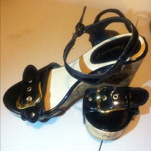 Black and gold wedge heels