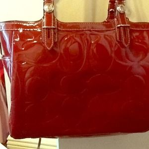 Red leather coach purse with grey interior