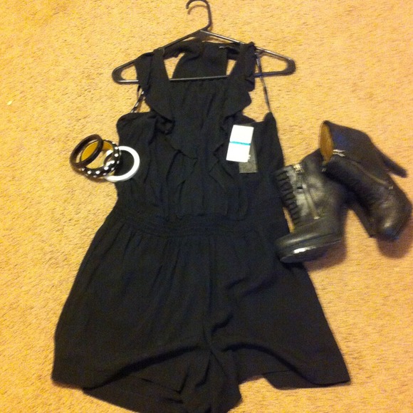 Never worn sexy black romper. A summer must have ❤