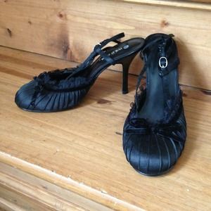 Black satin heels with velvet bow detail