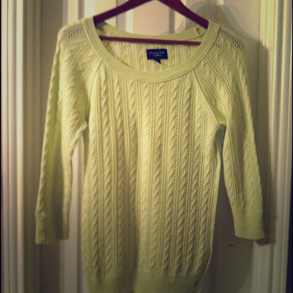 Lime green sweater .